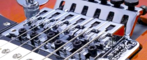 Guitar bridge adjustment and setup